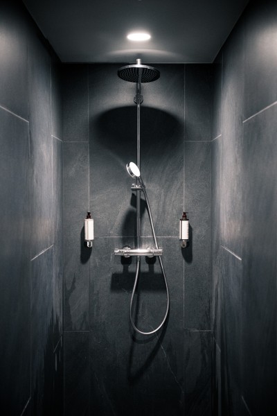 High-end designer bathroom in Wollongong featuring premium fittings, feature tiling and recessed shower niche